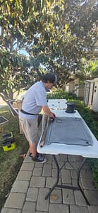 Mobile window screen repair setup at San Diego residence